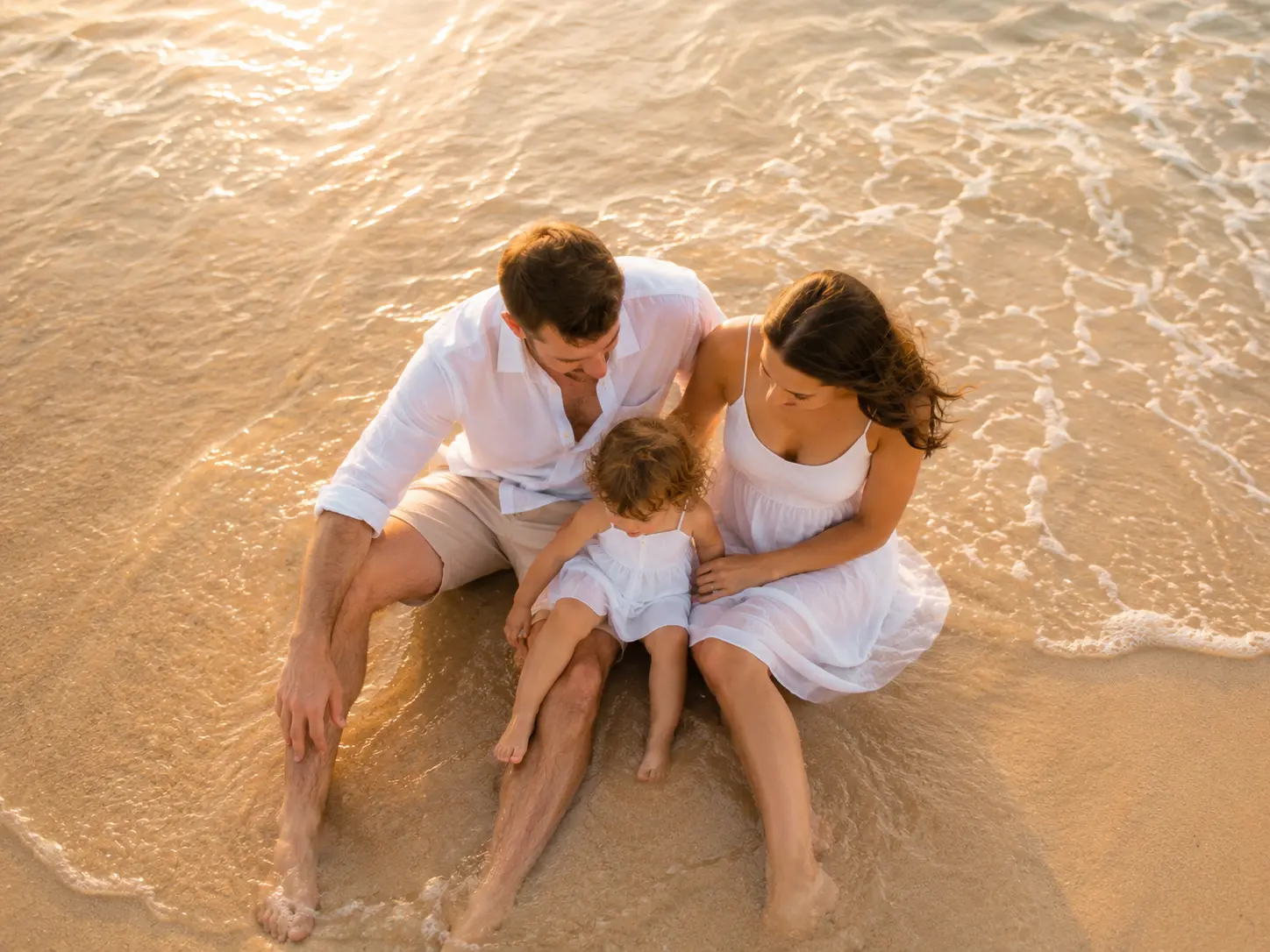 A family taking a gentle walk along the sea on their first day in Panama