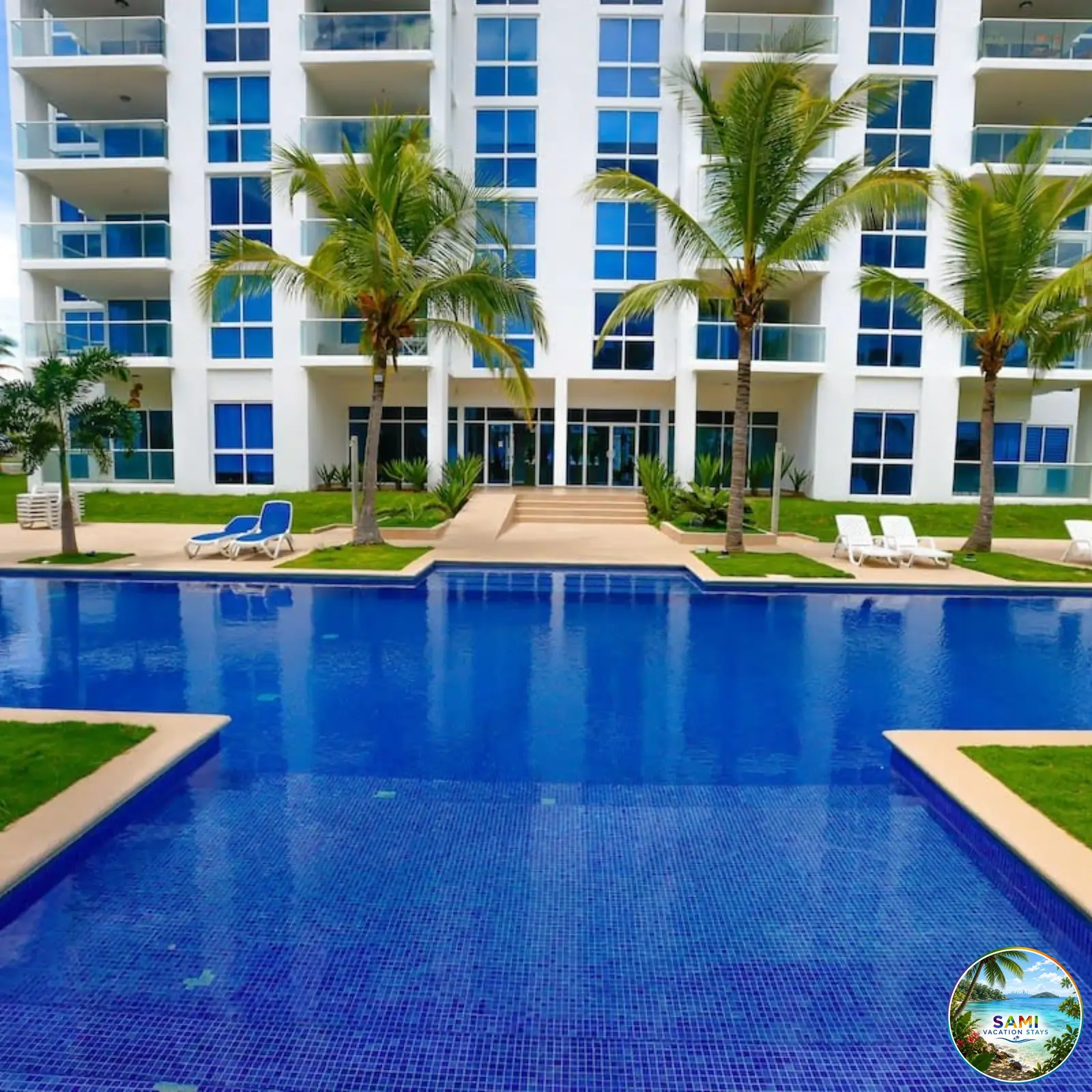 Beachfront resort swimming pool with clear blue water
