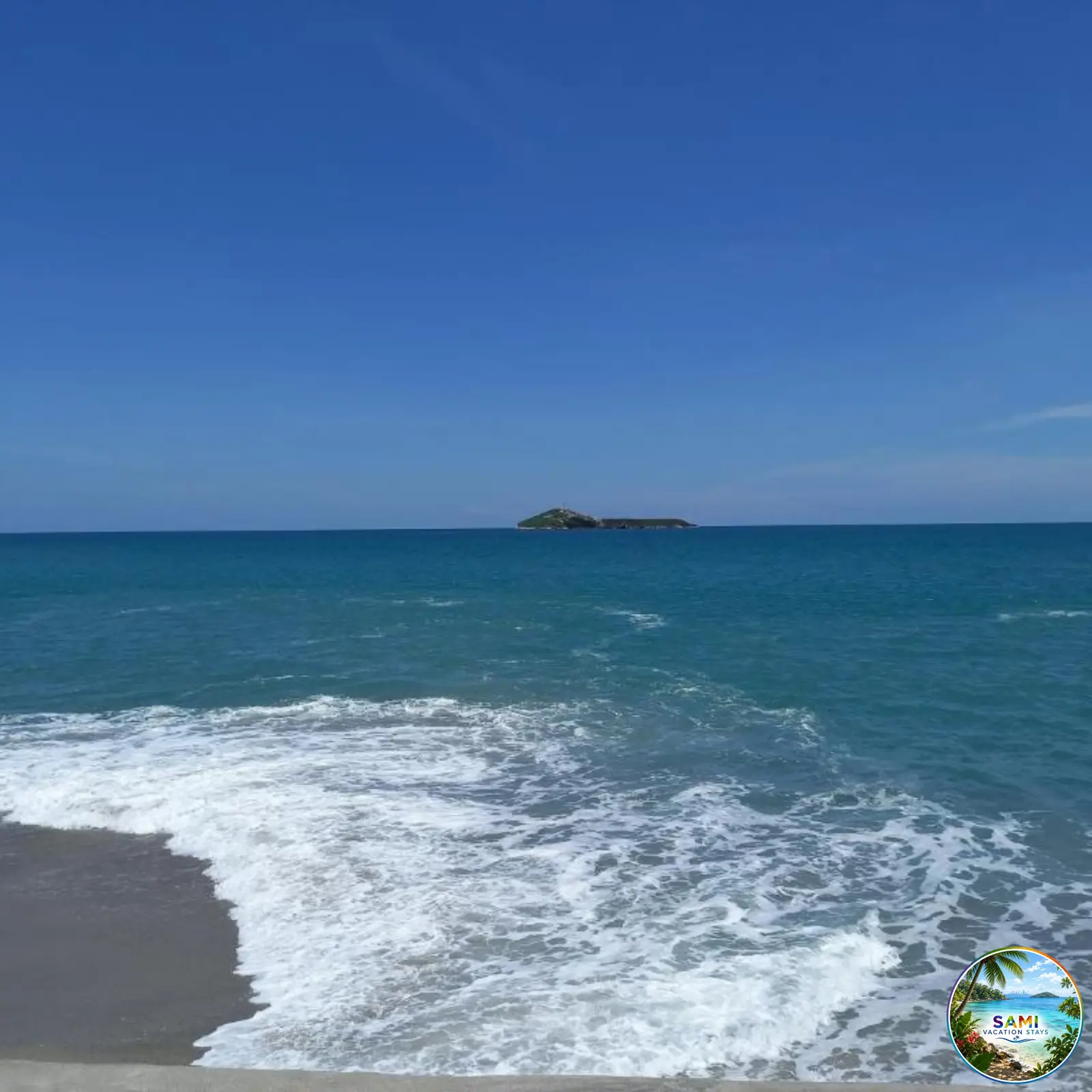 Blue ocean waves rolling onto the shoreline