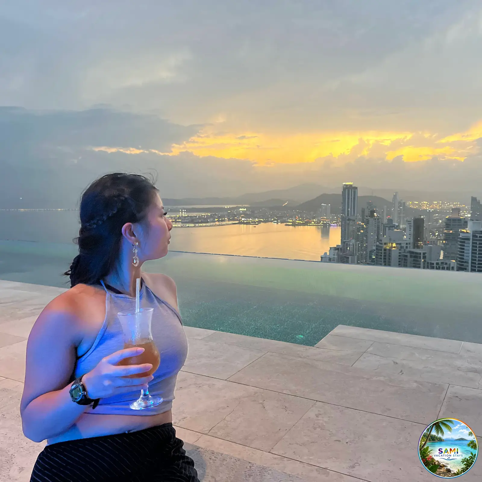 Rooftop infinity pool at city sunset
