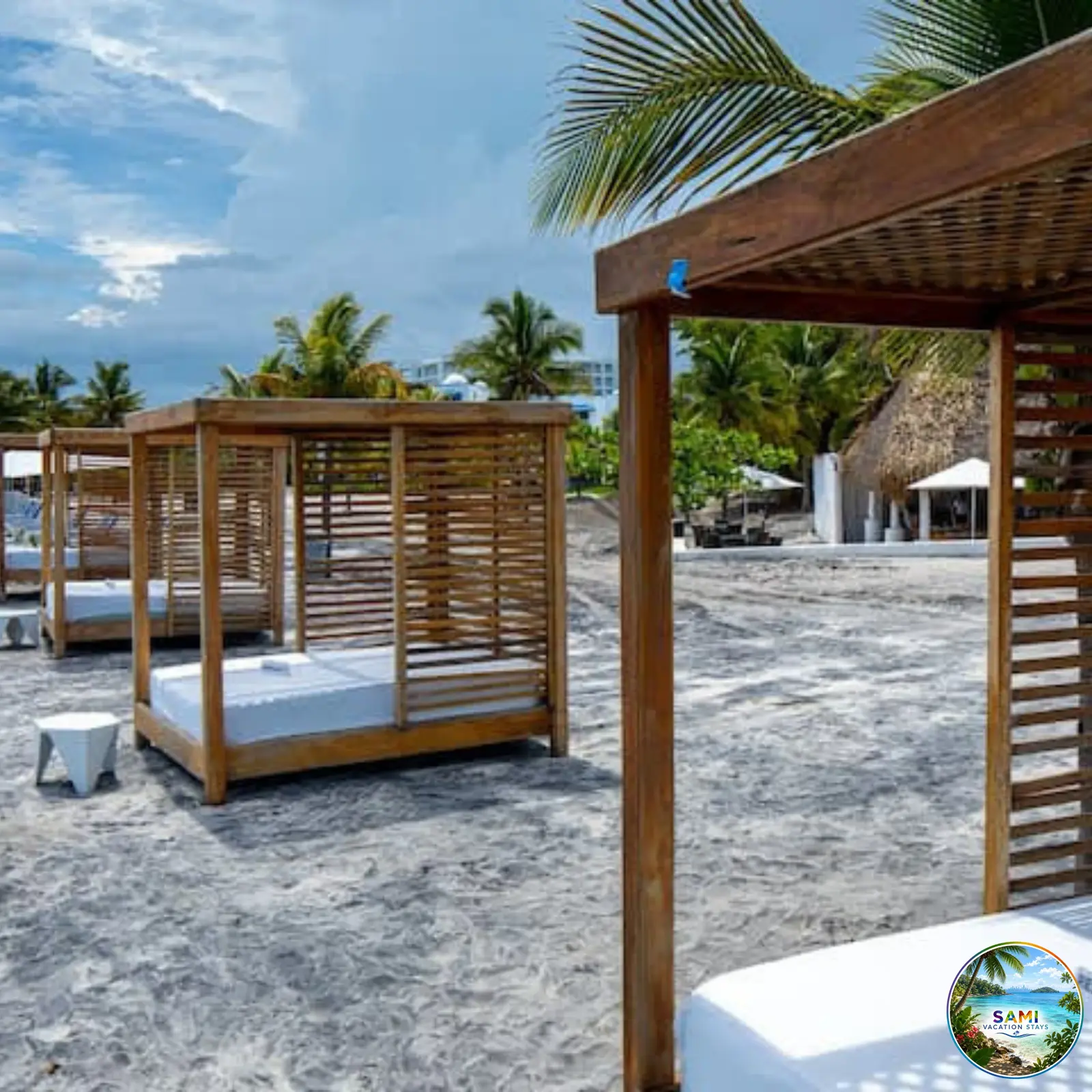 Wooden beach cabanas with daybeds