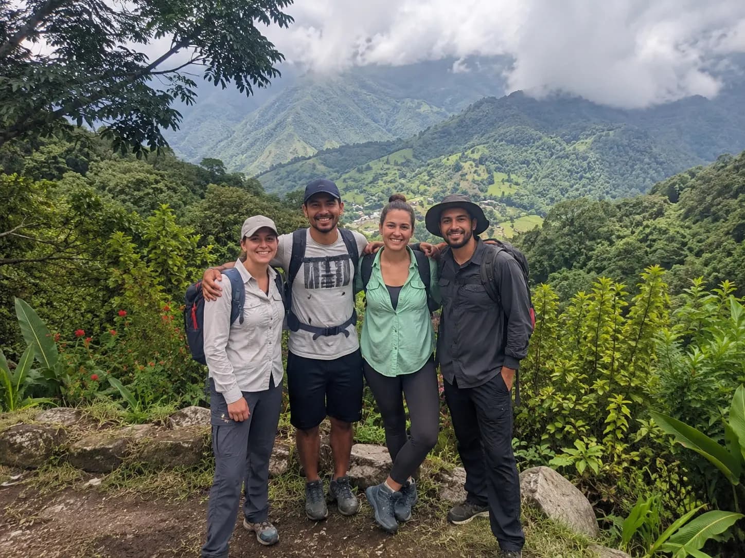 Two couples pausing to enjoy the view together at a mountain top in Panama